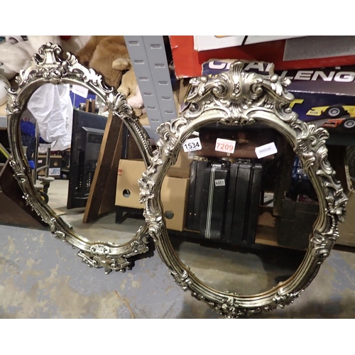 1534 - Two silver ornate framed wall mirrors, H: 73 cm. Not available for in-house P&P