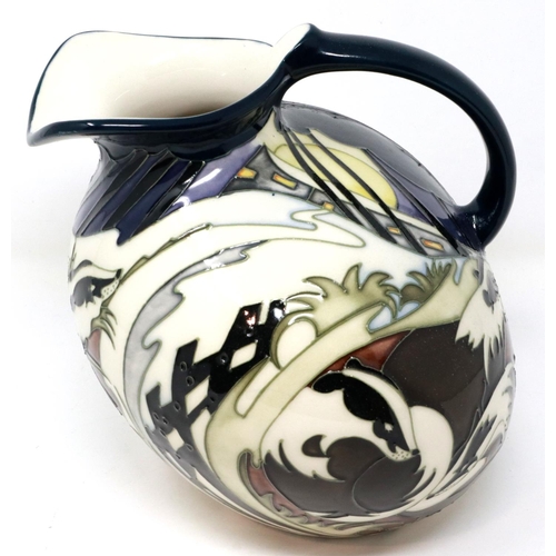 246 - Moorcroft trial jug decorated with badgers and foxes, H: 23 cm, crack to jug near handle and chip to... 