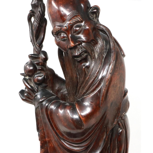 288 - Carved hardwood statue of Shou Lao (Shou Xing) Taoist God of Longevity, standing on a bat, H: 60 cm.... 