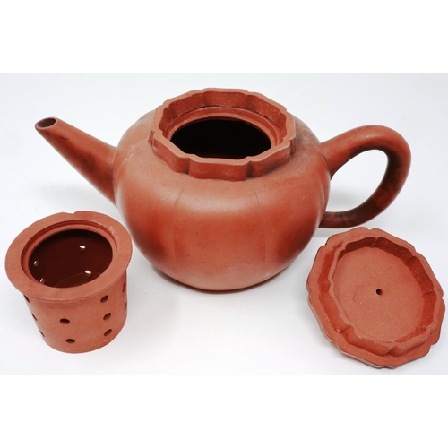 293 - Oriental terracotta teapot, with four character marks to base, H: 14 cm, damage to finial. P&P Group... 