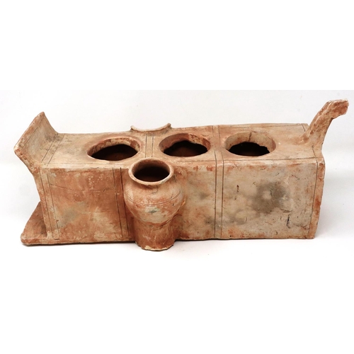 303 - A Han Dynasty terracotta funerary offering vessel, having five apertures (one damaged), L: 42 cm. P&... 