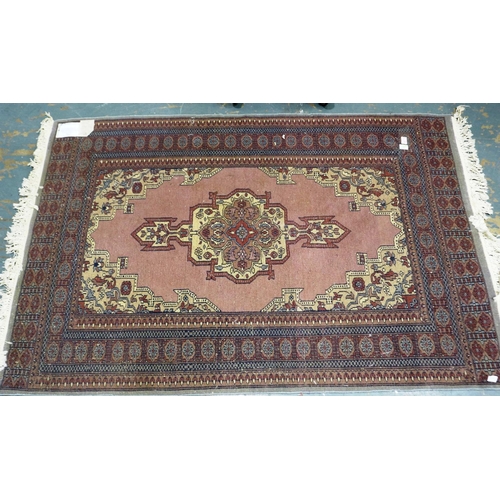 378 - A 20th century Middle Eastern hand knotted floor rug, fringed, 180 x 120 cm. Not available for in-ho... 