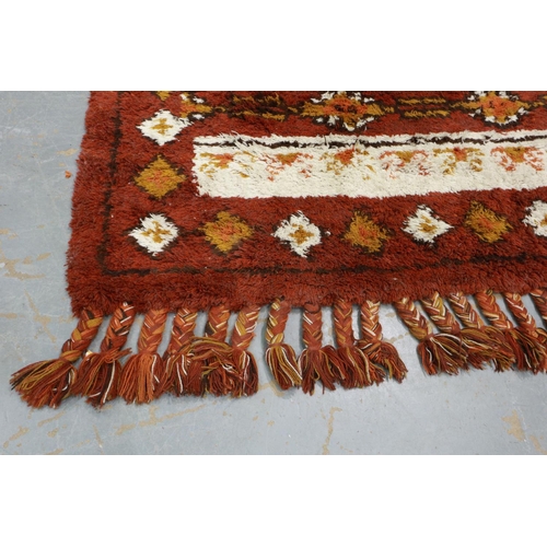 380 - Large mid 20th century hand knotted South American floor rug, with plaited tassels. Not available fo... 