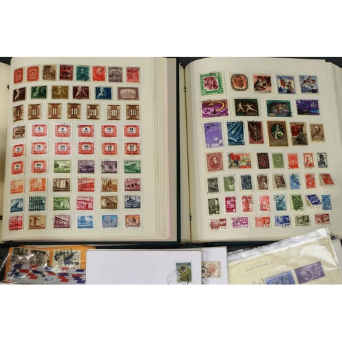 423 - Two stamp albums containing British and worldwide stamps together with a quantity of loose stamps an... 