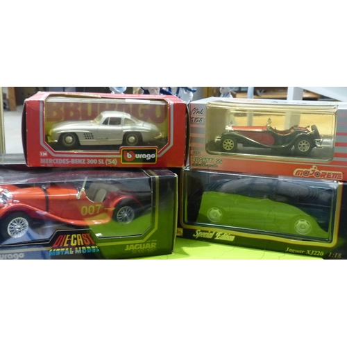 1458 - Four model cars to include Burago and Maisto, 1/18 and 1/24 scale. P&P Group 3 (£25+VAT for the firs... 