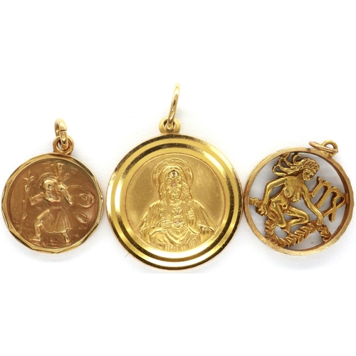 66 - Three 9ct gold Religious pendants, largest H: 90 mm, combined 11.4g. P&P Group 1 (£14+VAT for the fi... 