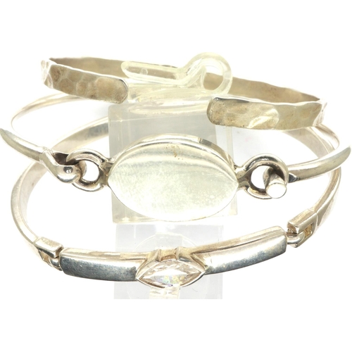 69 - Three 925 silver bangles including a stone set example, largest D: 70 mm. P&P Group 1 (£14+VAT for t... 