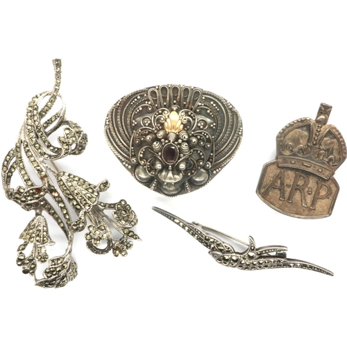 73 - Four 925 and hallmarked silver brooches to include stone set examples. P&P Group 1 (£14+VAT for the ... 