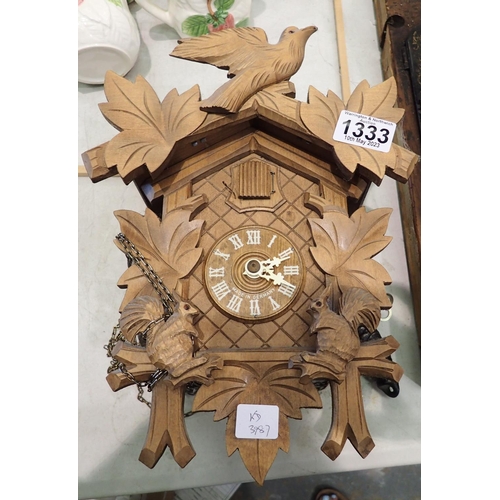 1333 - Carved German cuckoo clock with weights and pendulum, 30 x 18 x 13 cm. Not available for in-house P&... 