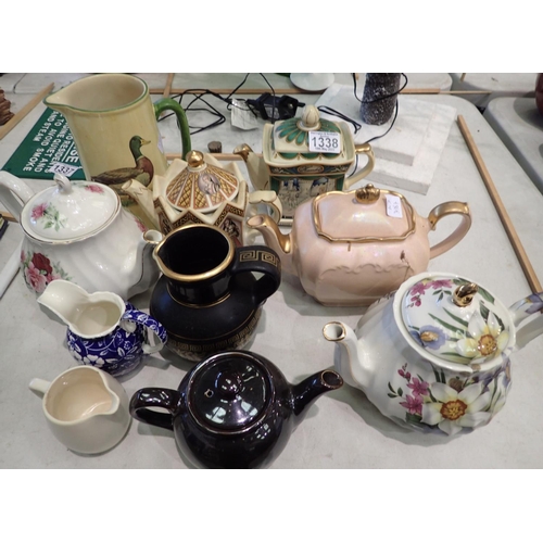 1338 - Collection of mixed ceramics, teapots and jugs. Not available for in-house P&P