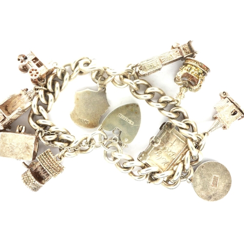 29 - Hallmarked silver charm bracelet with ten charms and a hallmarked silver padlock clasp, L: 18 cm, 68... 