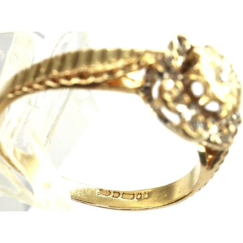 31 - 9ct gold daisy ring set with diamonds, size K, 1.8g. P&P Group 1 (£14+VAT for the first lot and £1+V... 