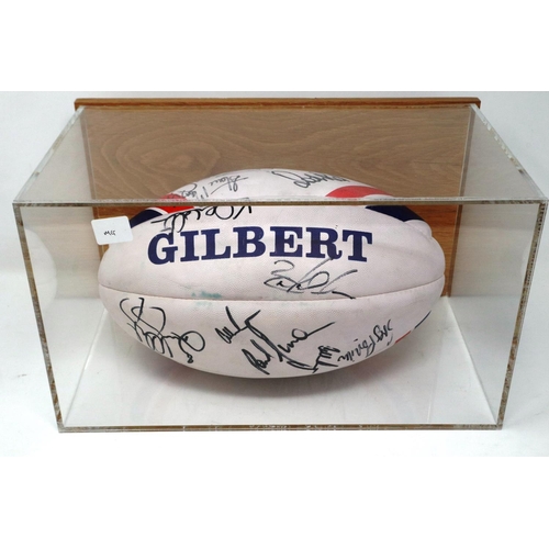 2138 - Gilbert team signed rugby ball, within a wall mounting Perspex display case, 36 x 22 x 21 cm H. P&P ... 