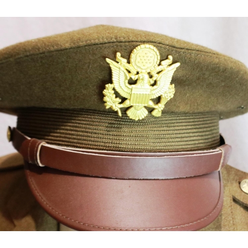 2245 - American post-war military dress uniform, comprising tunic, trousers, visor cap, shirt and tie, some... 