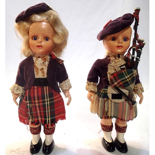 2067 - Two Rogark Scottish dolls, celluloid with sleep eyes, arm jointed arms, piper and dancer, in very go... 