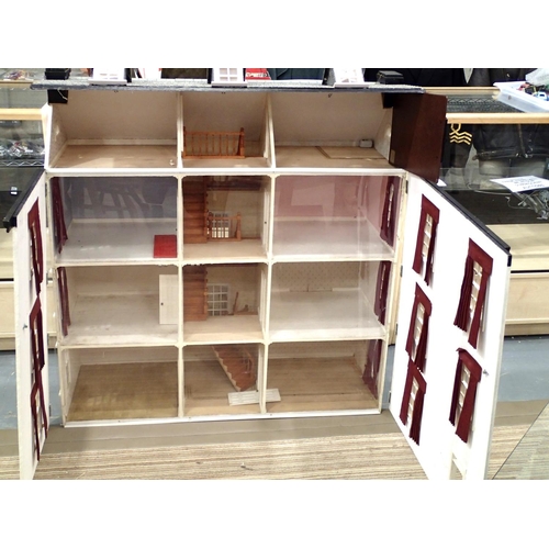 2070 - Large dolls house of wood construction, possibly Dolls House Emporium, six rooms, hallway, three lan... 