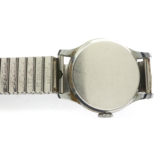 127 - SMITHS EMPIRE: gents 5 jewel wristwatch on a stainless steel expanding bracelet, working at lotting.... 