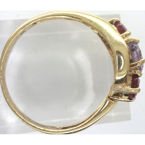 56 - 9ct gold ring with amethyst and rubies, boxed, size N, 2.3g. P&P Group 1 (£14+VAT for the first lot ... 