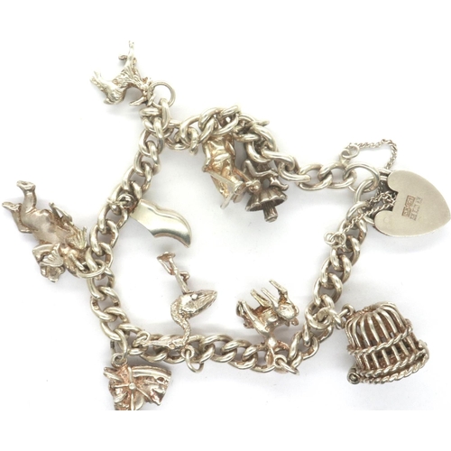 85 - Hallmarked silver charm bracelet with nine 925 silver charms, and hallmarked silver clasp, L: 18 cm,... 