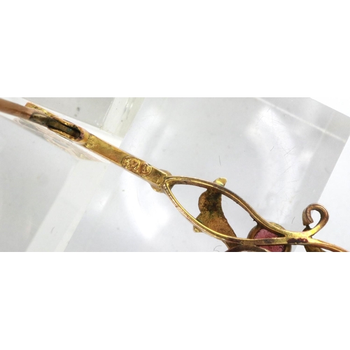 86 - 9ct gold bar brooch set with amethyst and seed pearl, L: 60 mm, 2.2g. P&P Group 1 (£14+VAT for the f... 