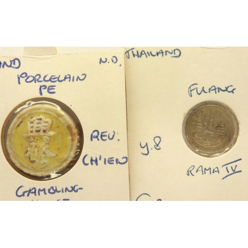 157 - 19th century Thai porcelain gambling tokens and an 1860 silver Fuang of Rama IV (2). P&P Group 1 (£1... 