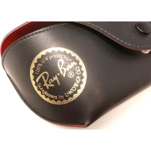 167 - A pair of Ray-Ban sunglasses with black case. Some light scratches to lenses, arms are stretched. P&... 