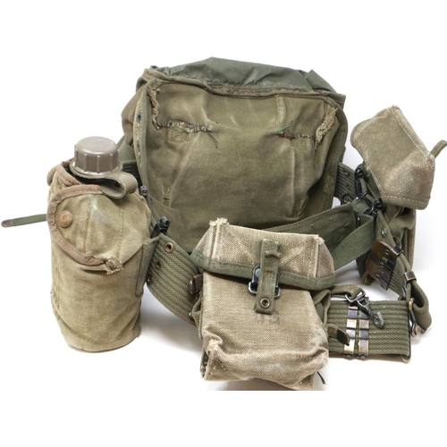 193 - US Vietnam War period basic M56 webbing set, comprising the M56 belt, two M56 ammo pouches, GI butt ... 