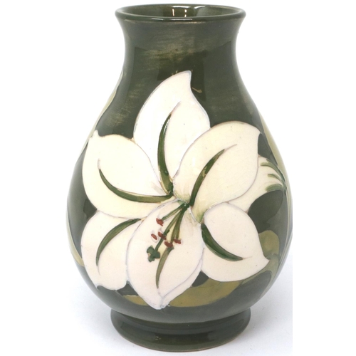 222 - Green ground Moorcroft vase in the Hibiscus pattern, with The Late Queen Mary sticker to base (distr... 