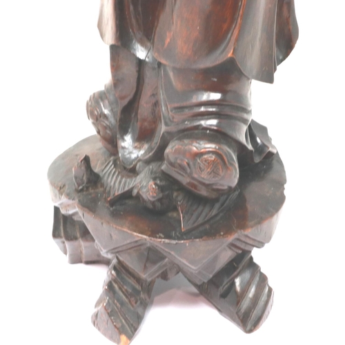 303 - Carved hardwood statue of Shou Lao (Shou Xing) Taoist God of Longevity, standing on a bat, H: 60 cm.... 