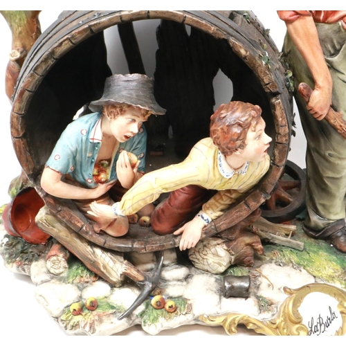 274 - Large Capodimonte figural group, Huck Finn and Tom Sawyer in an apple orchard, signed La Burla with ... 