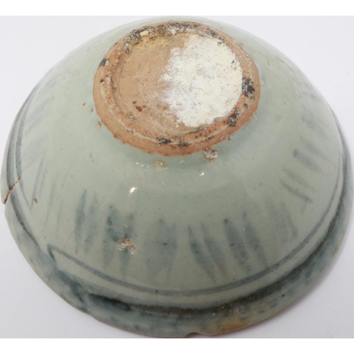 295 - A Ming Dynasty bowl, glazed with blue painted decoration, D: 12 cm, H: 5 cm. Small chips to rim and ... 