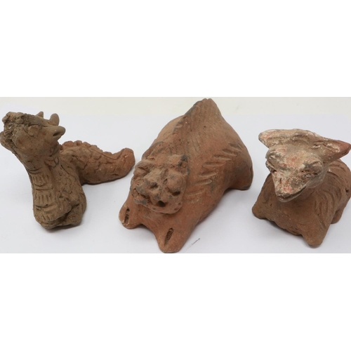298 - A Han Dynasty zoomorphic clay figure of a recumbent goat, serpent and another beast (3), largest H: ... 
