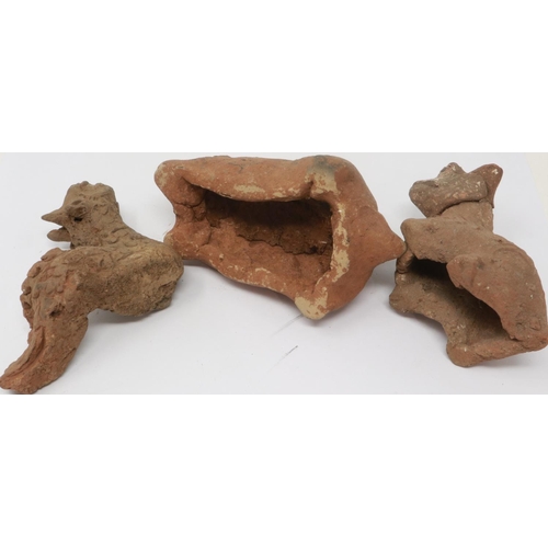 298 - A Han Dynasty zoomorphic clay figure of a recumbent goat, serpent and another beast (3), largest H: ... 