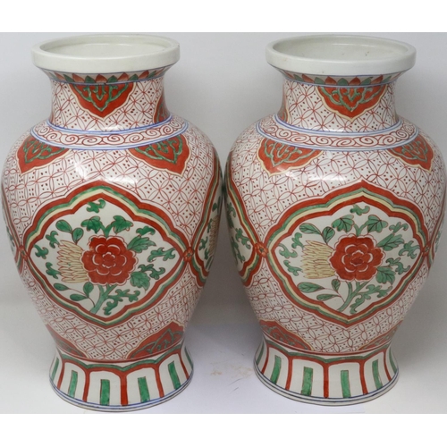 300 - Pair of 19th century Chinese vases, each H: 40 cm, with polychrome decoration, slight wear to paint ... 