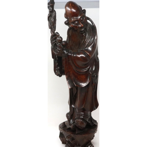 303 - Carved hardwood statue of Shou Lao (Shou Xing) Taoist God of Longevity, standing on a bat, H: 60 cm.... 