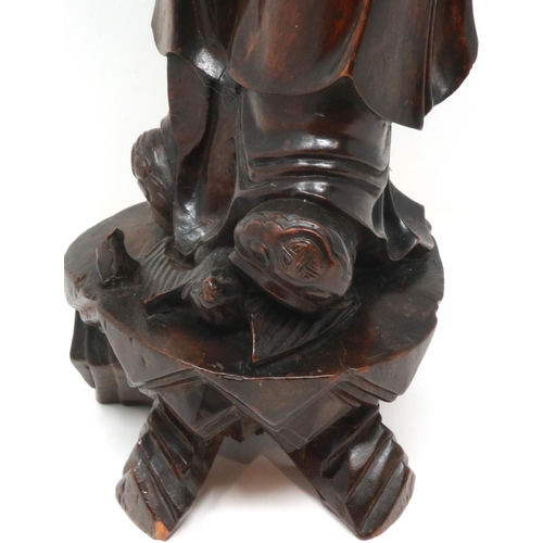 303 - Carved hardwood statue of Shou Lao (Shou Xing) Taoist God of Longevity, standing on a bat, H: 60 cm.... 
