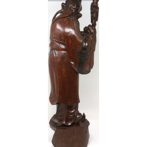 303 - Carved hardwood statue of Shou Lao (Shou Xing) Taoist God of Longevity, standing on a bat, H: 60 cm.... 