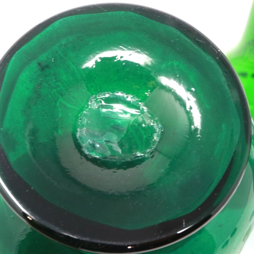 323 - Mary Gregory green glass decanter with enamelled cherub design and three similar examples with match... 