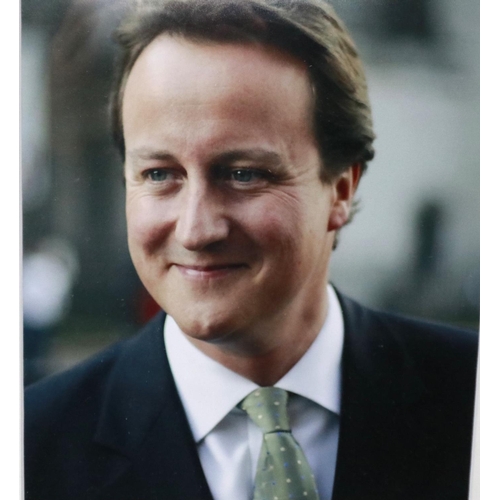 375 - Framed David Cameron press photograph and signature. P&P Group 2 (£18+VAT for the first lot and £3+V... 