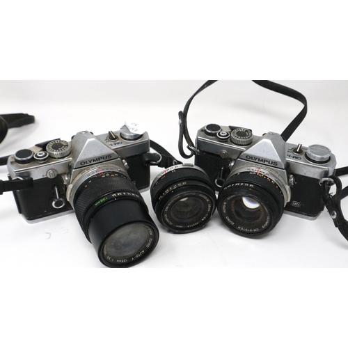 428 - Two Olympus OM-1 SLR cameras with lenses. P&P Group 1 (£14+VAT for the first lot and £1+VAT for subs... 