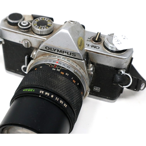 428 - Two Olympus OM-1 SLR cameras with lenses. P&P Group 1 (£14+VAT for the first lot and £1+VAT for subs... 