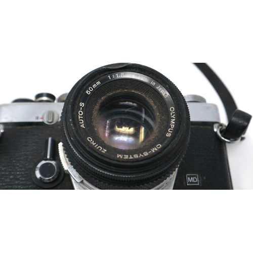 428 - Two Olympus OM-1 SLR cameras with lenses. P&P Group 1 (£14+VAT for the first lot and £1+VAT for subs... 