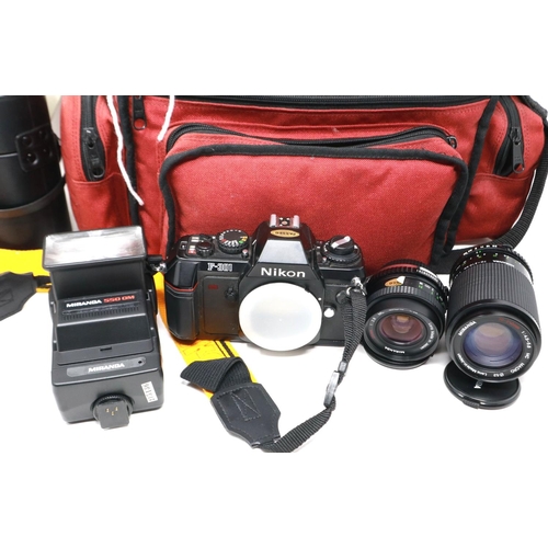 432 - Nikon F301 SLR camera body with Miranda lens, with further lenses and bag. P&P Group 2 (£18+VAT for ... 