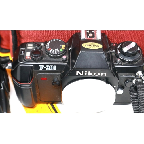 432 - Nikon F301 SLR camera body with Miranda lens, with further lenses and bag. P&P Group 2 (£18+VAT for ... 