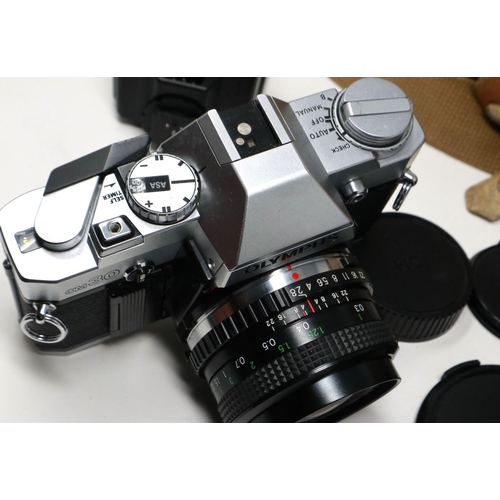 434 - Olympus OM-30 photographic outfit with mixed lenses. P&P Group 2 (£18+VAT for the first lot and £3+V... 