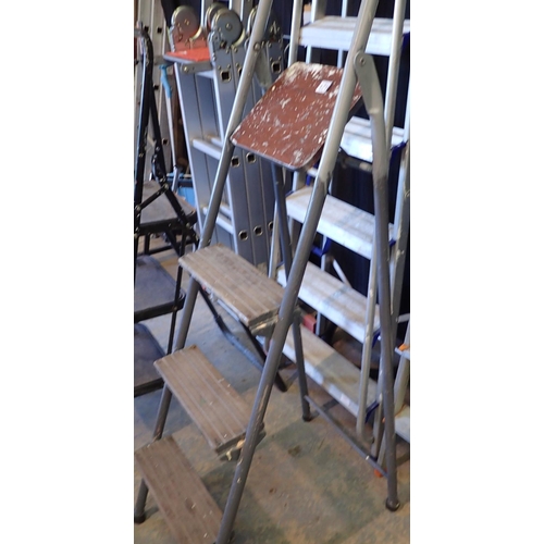 1710 - Set of metal framed ladders with four wooden rungs. Not available for in-house P&P.