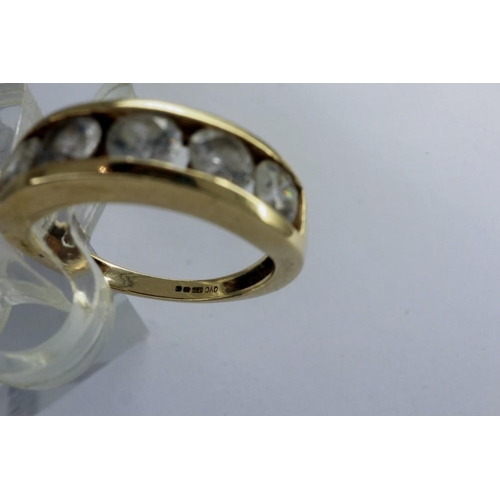 16 - 9ct gold channel set ring with five cubic zirconia, size J, 3.5g. P&P Group 1 (£14+VAT for the first... 