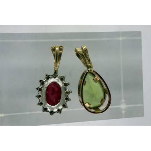 51 - Two yellow metal pendants, one marked 9K, one set with a ruby, combined 0.9g. P&P Group 1 (£14+VAT f... 