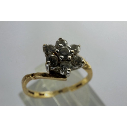 59 - 9ct gold flower head ring set with seven cubic zirconia, size J/K, 1.9g. P&P Group 1 (£14+VAT for th... 