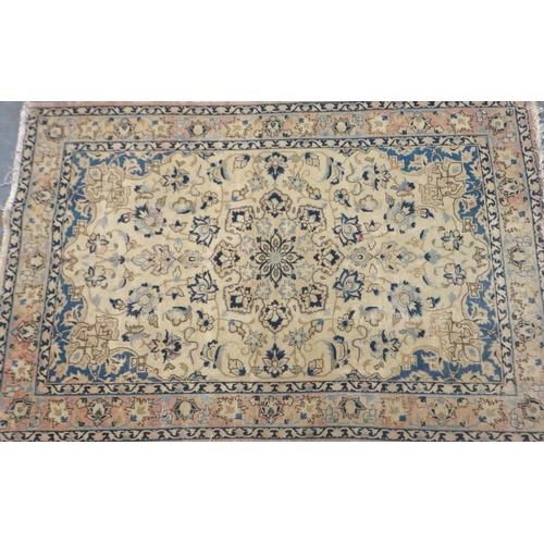 2095 - Early 20th century floor rug with designs in blue against a red faded ground, 155 x 100 cm. Not avai... 